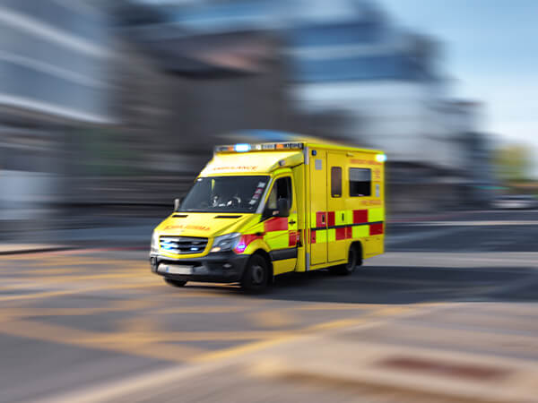 Yellow ambulance rushing toward the ER