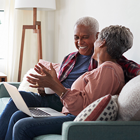Older couple talking and smiling together